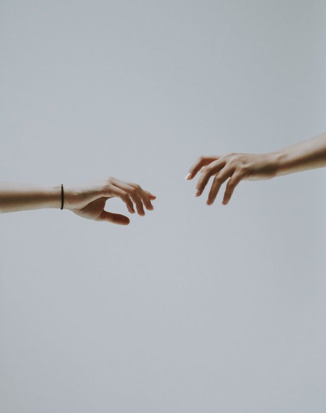 Hands reaching