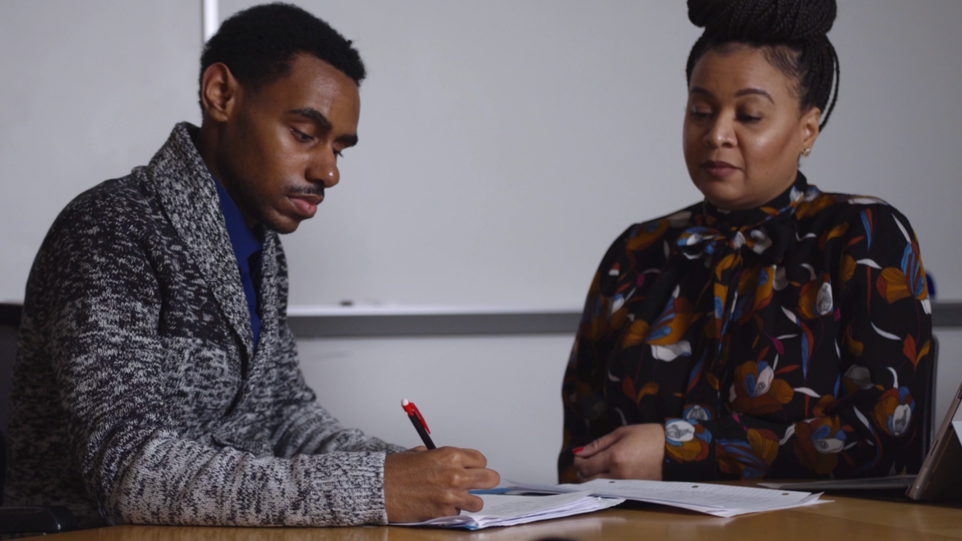 man and woman doing taxes